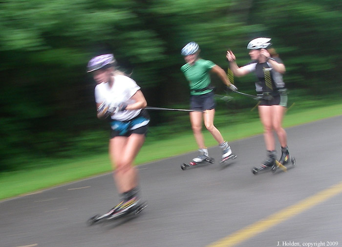 Roller skiers on the last descent, Gatineau Parkway.