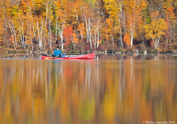 Red canoe, orange leaves, Lac Champagneur